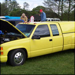 Yellow Chevrolet truck H86KFL