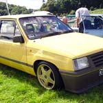 Yellow Vauxhall Nova D682WJB
