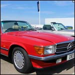 Red Mercedes Benz R107 SL C83DJD at the Silverstone Classic 2013