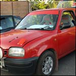 Red Nissan Micra M852ORN