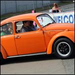 Orange VW Beetle at the Silverstone Classic 2013