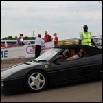Black Ferrari convertible at the Silverstone Classic 2013
