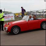 Red Austin Healey Frogeye Sprite at the Silverstone Classic 2013
