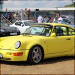 Yellow 964 Porsche 911 at the Silverstone Classic 2013