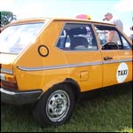 Yellow VW Polo Mk1 Taxi CWL640V